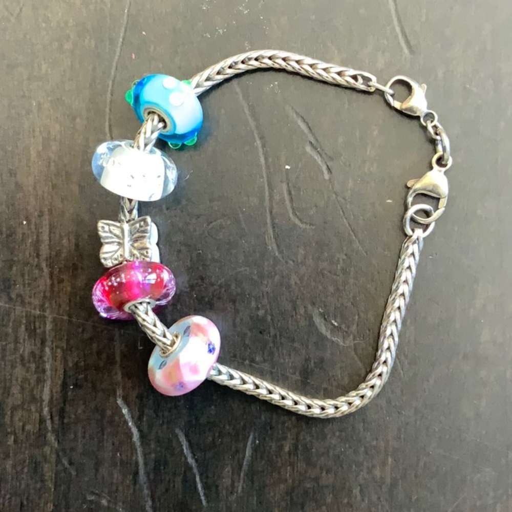 Pandora sterling bracelets with 5 charms.